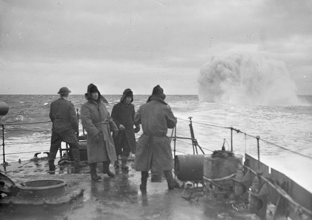 An unidentified V/W class destroyer dropping a depth charge. The ...