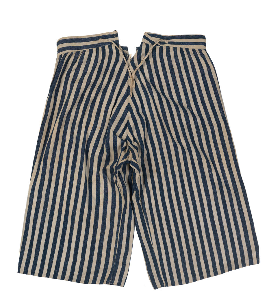 Pair of handmade trousers (back) made of blue and white striped ticken