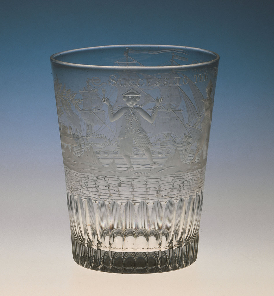 A tumbler engraved with a ship wearing a British ensign and pennant ...